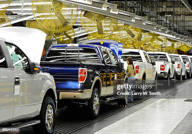 Janna Dake, a Ford inspector for 20 years, works the final assembly line for the F-150 pickup at the Kansas City Ford Assembly plant October 2, 2008...