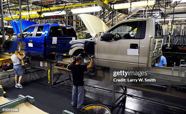 Ford employees work on the final assembly line for the Ford F-150 pickup at the Kansas City Ford Assembly plant October 2, 2008 in Claycomo,...