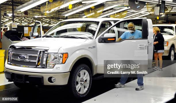 Employees work on the assembly line of the F-150 pickup at the Kansas City Ford Assembly plant October 2, 2008 in Claycomo, Missouri. Ford's Kansas...