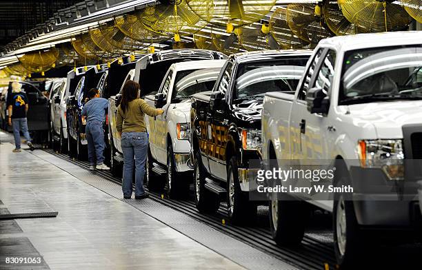 Janna Dake, a Ford inspector for 20 years, works the final assembly line for the F-150 pickup at the Kansas City Ford Assembly plant October 2, 2008...