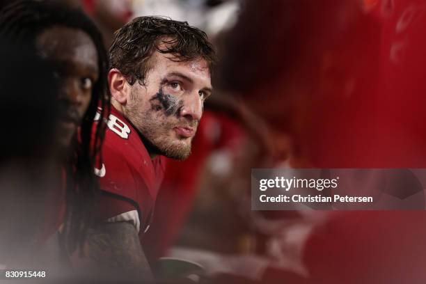 Inside linebacker Scooby Wright of the Arizona Cardinals watches from the bench during the NFL game against the Oakland Raiders at the University of...