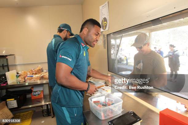 Players help out in the canteen during an Australian Wallabies fan day on August 13, 2017 in Penrith, Australia.