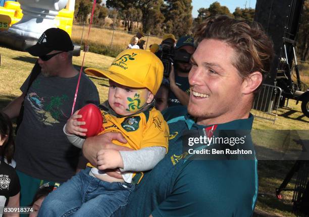 Michael Hooper with young Ellery Klaassen from Penrtih during an Australian Wallabies fan day on August 13, 2017 in Penrith, Australia.