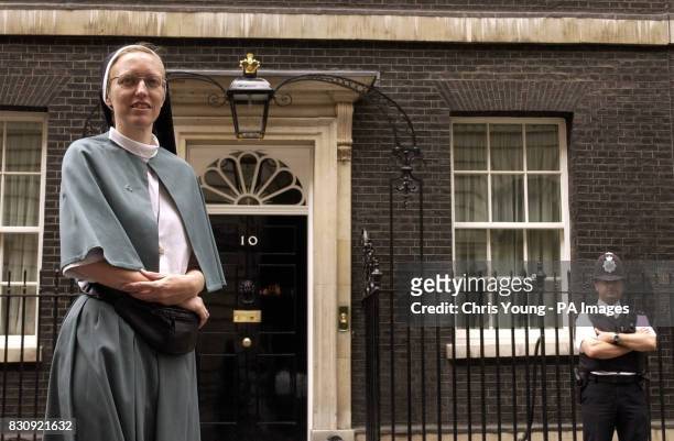 Sister Annaliese Brogden of the Community of the Sisters of the Church, pauses outside No 10 Downing Street after members of Pax Christie, an...