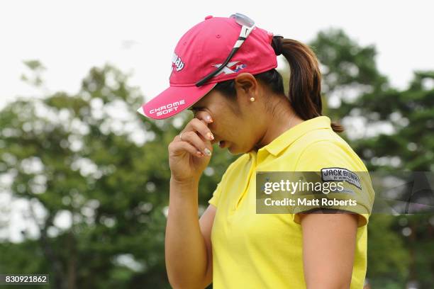 Mamiko Higa of Japan is seen wiping tears from her eyes after winning the final round of the NEC Karuizawa 72 Golf Tournament 2017 at the Karuizawa...