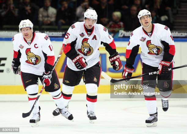 Daniel Alfredsson, Dany Heatley and Jason Spezza of the Ottawa Senators celebrate a third period goal against the Frolunda Indians at Scandinavium...
