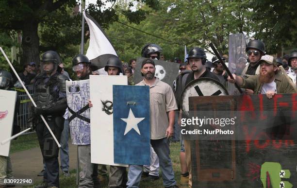Demonstrators hold shields during the Unite the Right free speech rally at Emancipation Park in Charlottesville, Virginia, USA on August 12, 2017.