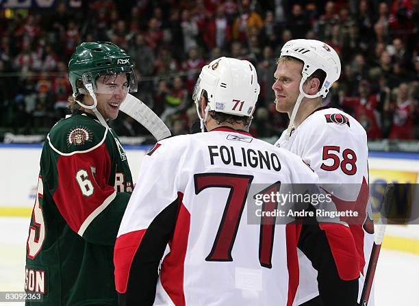 Nick Foligno and Cody Bass of the Ottawa Senators talk with the Senators' 2008 first round draft pick Erik Karlsson of the Frolunda Indians after...