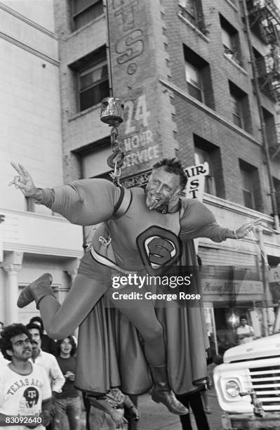 Screw Magazine publisher, Al Goldstein, entertains a crowd of onlookers outside the 1980 Hollywood, California, Adult Entertainment Awards held at...