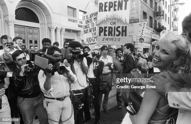 Religious fanatics hold a demonstration in front of onlookers outside the 1980 Hollywood, California, Adult Entertainment Awards held at the...