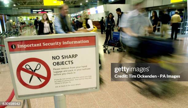 Sign warning people not to pack sharp objects when they travel abroad. Around 15,000 sharp objects are confiscated every day from hand luggage at...