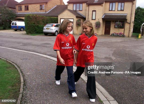 Two child actors, playing Jessica Chapman, left, and Holly Wells, leave Holly Wells House in Redhouse Gardens as they take part in a police...