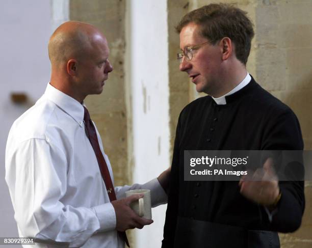 Kevin Wells, father of missing schoolgirl Holly Wells, talks to Reverend Tim Alban-Jones after the sunday morning service at St Andrews church in...