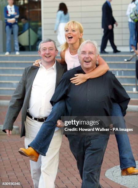 Popstars - The Rivals judges, from left to right; Louis Walsh Geri Halliwell and Pete Waterman pose for photographers outside the Lowry Hotel in...