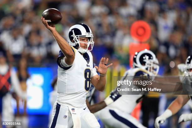 Dan Orlovsky of the Los Angeles Rams passes the ball during the second half of a preseason game against the Dallas Cowboys at Los Angeles Memorial...