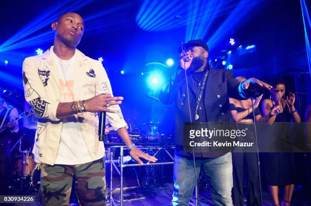 Pharrell Williams performs onstage with the Roots at Apollo in the Hamptons 2017: hosted by Ronald O. Perelman at The Creeks on August 12, 2017 in...