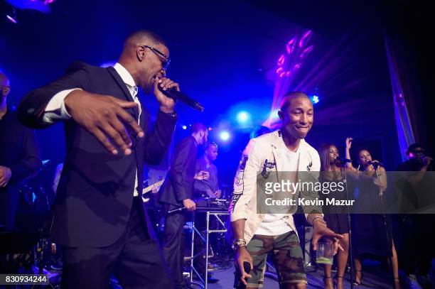 Jamie Foxx and Pharrell Williams perform onstage at Apollo in the Hamptons 2017: hosted by Ronald O. Perelman at The Creeks on August 12, 2017 in...