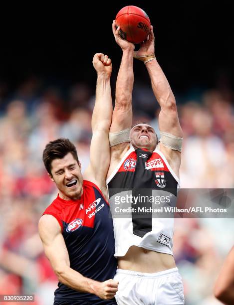 Luke Dunstan of the Saints and Alex Neal-Bullen of the Demons compete for the ball during the 2017 AFL round 21 match between the Melbourne Demons...