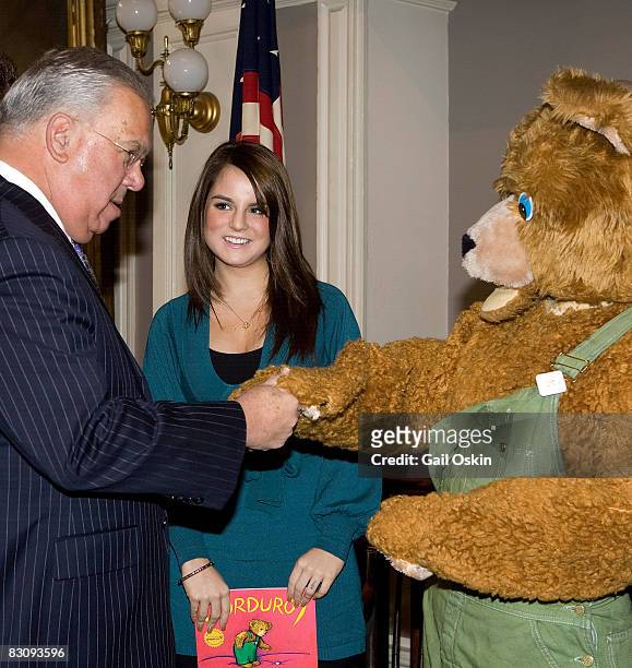 Songwriter and actress Jo Jo, center, smiles as Boston Mayor Thomas Menino shakes hands with the Corduroy Bear at Jumpstart's Read for the Record at...