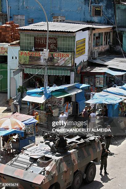 Brazilian soldiers patrol the main entrance of the "Rocinha" shantytown in Rio de Janeiro on September 19, 2008. Some 3,500 soldiers have been...