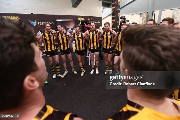 The Hawks celebrate after they defeated the Kangaroos during the round 21 AFL match between the Hawthorn Hawks and the North Melbourne Kangaroos at...