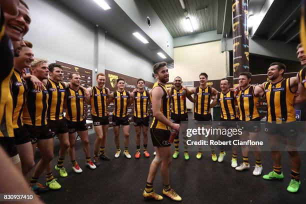 The Hawks celebrate after they defeated the Kangaroos during the round 21 AFL match between the Hawthorn Hawks and the North Melbourne Kangaroos at...