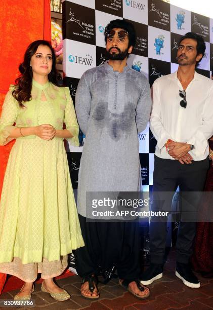Indian Bollywood actors Dia Mirza , Jackky Bhagnani and Arjun Rampal pose for a photograph during the launch of Gaj Yatra, a campaign to save India's...