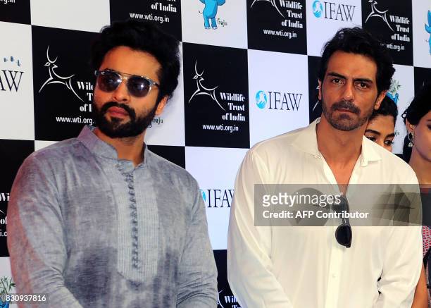 Indian Bollywood actors Jackky Bhagnani and Arjun Rampal pose for a photograph during the launch of Gaj Yatra, a campaign to save India's wild...