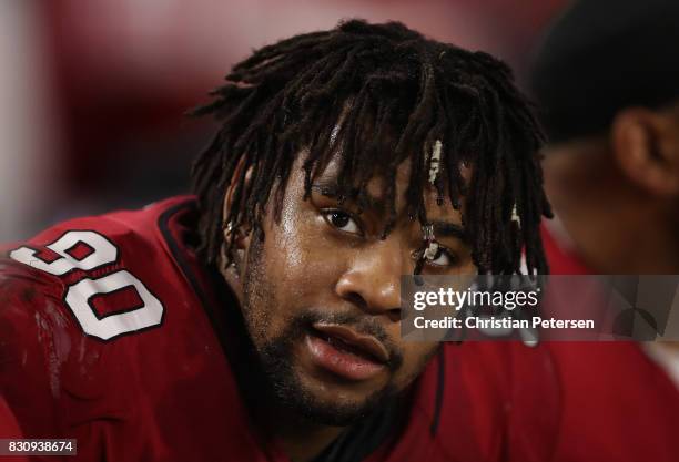 Defensive tackle Robert Nkemdiche of the Arizona Cardinals watches from the sidelines during the NFL game against the Oakland Raiders at the...