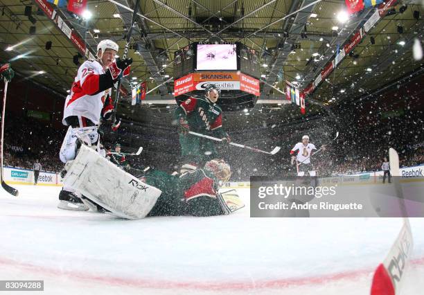Chris Neil of the Ottawa Senators avoids colliding with Ari Ahonen of the Frolunda Indians after a goal at Scandinavium Arena on October 2, 2008 in...