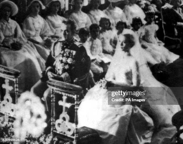 Prince Rainier III of Monaco and Grace Kelly, the Hollywood actress, at their religious marriage in the Cathedral of Monaco.