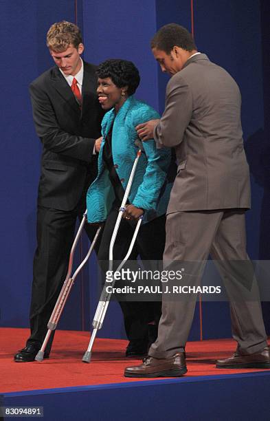 Journalist Gwen Ifill of PBS public television arrives on crutches prior to the vice presidential debate between Republican Sarah Palin and Democrat...