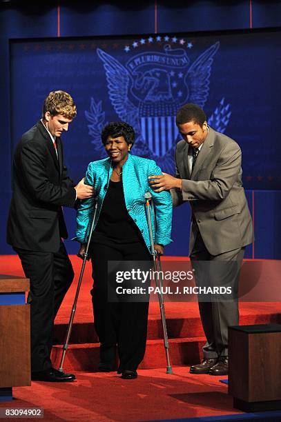 Journalist Gwen Ifill of PBS public television arrives on crutches prior to the vice presidential debate between Republican Sarah Palin and Democrat...