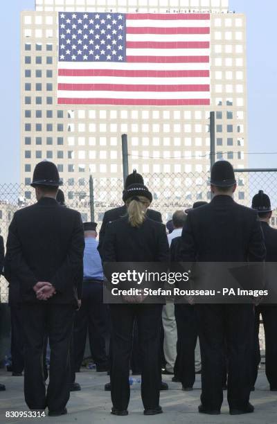 British policemen and women observe a minute's silence at Ground Zero in New York, on the first anniversary of the terrorist attacks on the World...