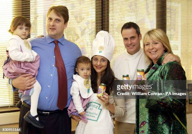 Ian and Penny Johnson with their daughters Alicia and Isabelle join TV presenter Fern Britton and chef Phil Vickery during a photocall in London to...