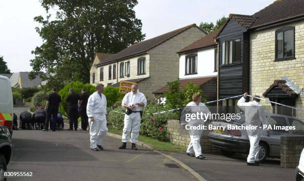 Forensic team outside the scene of a triple shooting at a house in the Broadoak cul-de-sac in Horton near Ilminster, Somerset. The mother and...