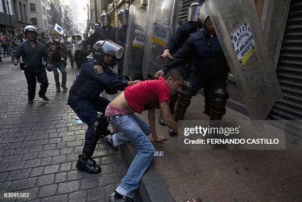 Student is arrested during violent demonstrations on the anniversary of the massacre of Tlatelolco, at the Plaza de las Tres Culturas, in Mexico...