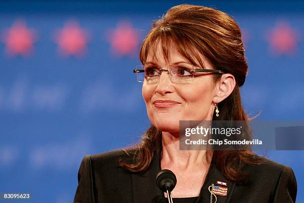 Republican vice presidential candidate Alaska Gov. Sarah Palin smiles while speaking during the vice presidential debate at the Field House of...