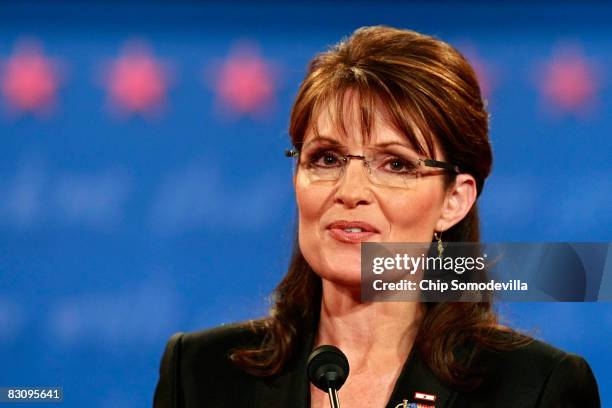 Republican vice presidential candidate Alaska Gov. Sarah Palin smiles while speaking during the vice presidential debate at the Field House of...