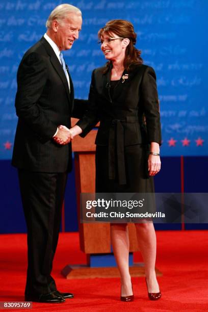 Democratic vice presidential candidate U.S. Senator Joe Biden shakes hands with Republican vice presidential candidate Alaska Gov. Sarah Palin after...