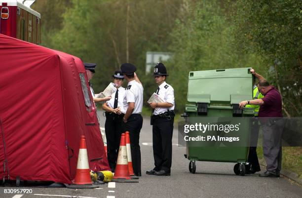 Police at the road block near Yateley Heath, Minley, near Fleet in Hampshire where the remains of missing schoolgirl Amanda Dowler were found. * More...