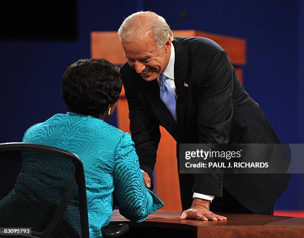 Democrat Joseph Biden greets moderator Gwen Ifill following his vice presidential debate with Republican Sarah Palin October 2, 2008 at Washington...