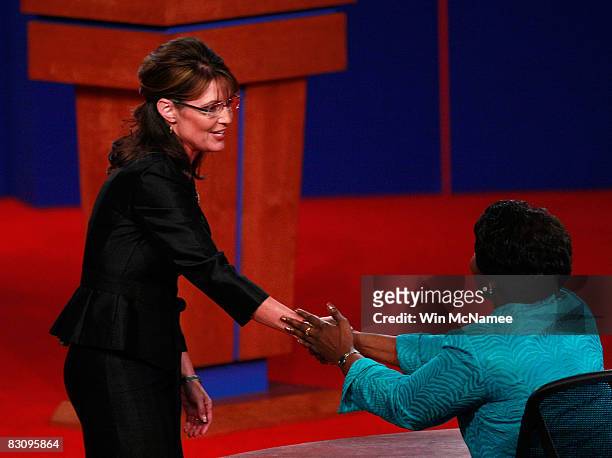 Republican vice presidential candidate Alaska Gov. Sarah Palin shakes hands with moderator Gwen Ifill after the vice presidential debate at the Field...