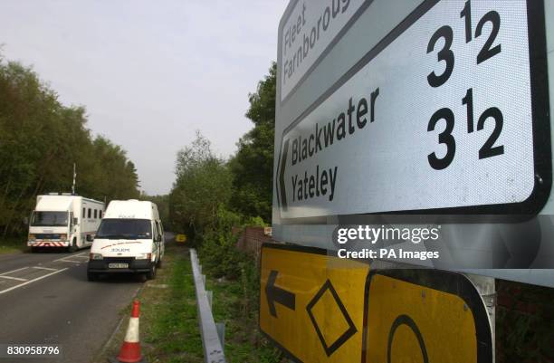 Police vehicles at the police road block near Yateley Heath, Minley, near Fleet in Hampshire, where the remains of missing schoolgirl Amanda Dowler...