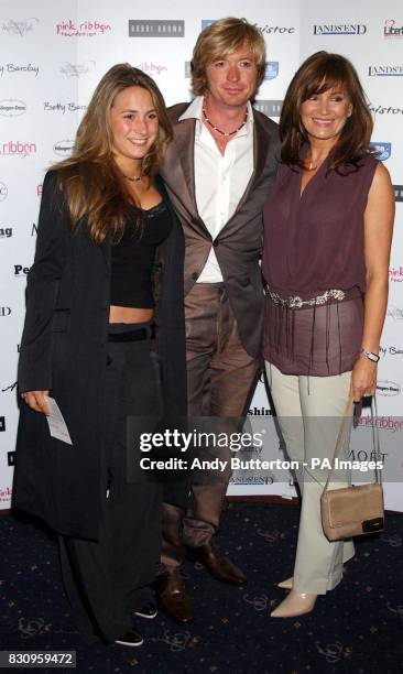 Hairdresser Nicky Clarke and his family during the Pink Ribbon fashion show at the Cafe de Paris in central London.