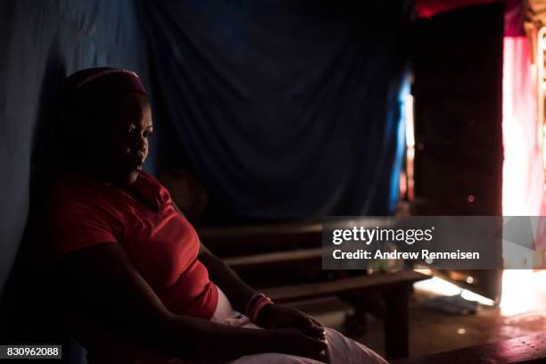 Woman sits inside Mwanzo Wa Dehema Church in the Kibera slum on August 13, 2017 in Nairobi, Kenya. A day prior, demonstrations turned violent in some...
