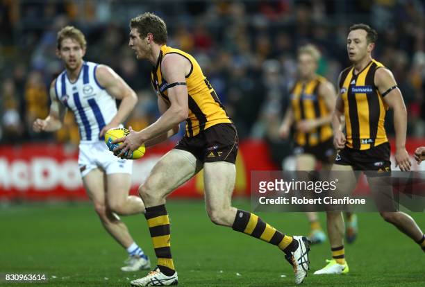 Ben McEvoy of the Hawks controls the ball during the round 21 AFL match between the Hawthorn Hawks and the North Melbourne Kangaroos at University of...