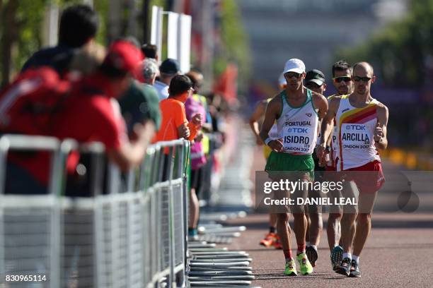 Portugal's Pedro Isidro and Spain's Francisco Arcilla compete in the en's 50km race walk athletics event at the 2017 IAAF World Championships on The...