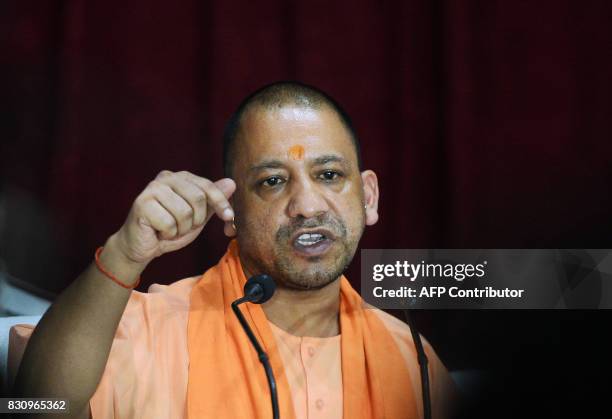 Chief Minister of Uttar Pradesh , Yogi Adityanath gestures during a press confrence after visiting the Baba Raghav Das Hospital in Gorakhpur, in the...