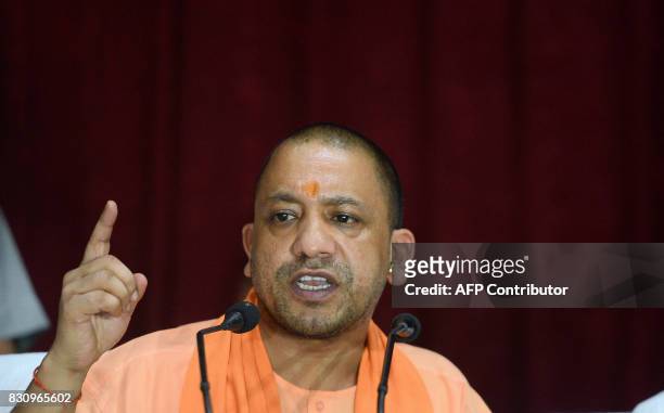 Chief Minister of Uttar Pradesh , Yogi Adityanath gestures during a press confrence after visiting the Baba Raghav Das Hospital in Gorakhpur, in the...
